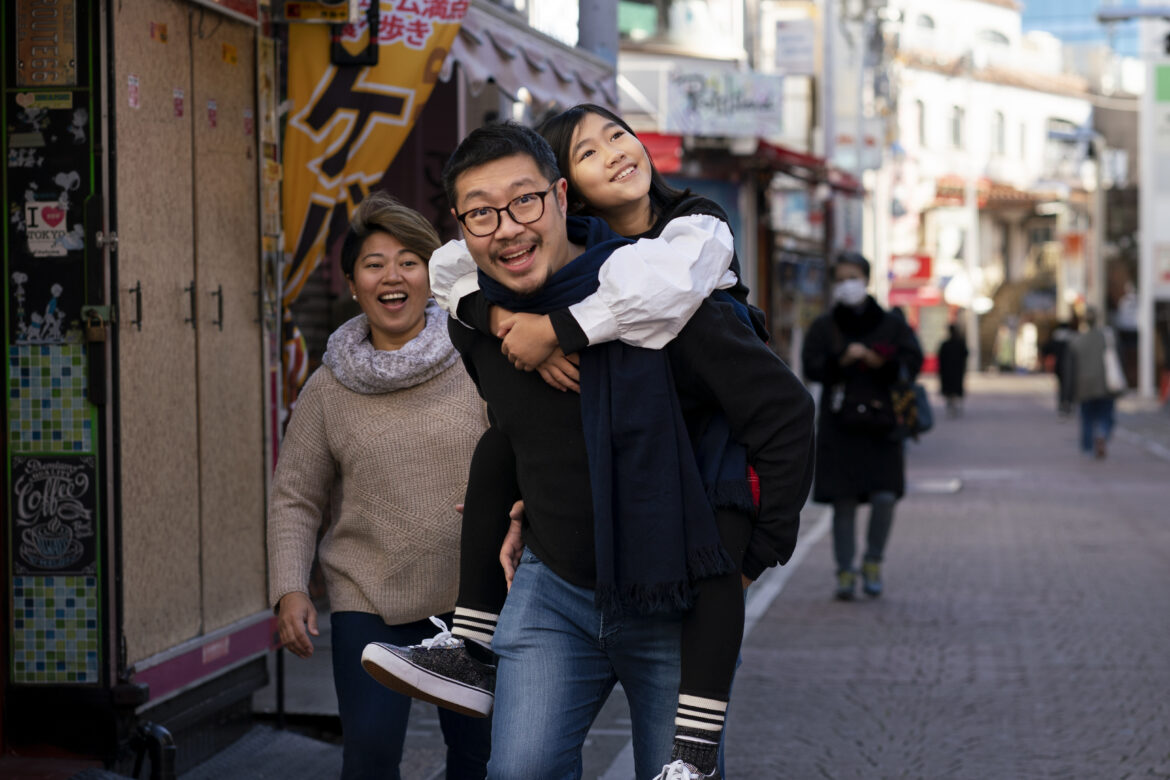 medium-shot-father-carrying-girl